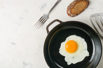 Morning in the kitchen. Cooking breakfast. Fried egg.