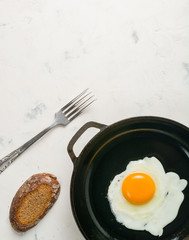 Morning in the kitchen. Cooking breakfast. Fried egg.