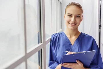 Happy therapeutic bracing against window in clinic