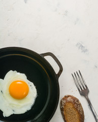 Morning in the kitchen. Cooking breakfast. Fried egg.