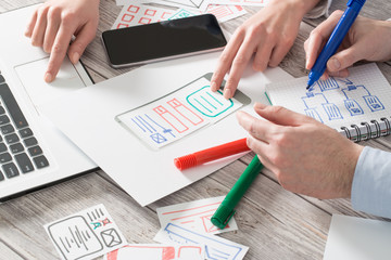 Designer drawing website ux app development.
