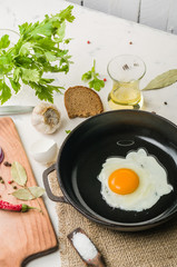 Morning in the kitchen. Cooking breakfast. Fried egg.
