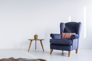 Fototapeta na wymiar White room with blue armchair