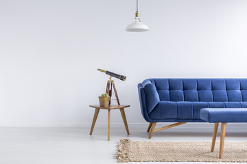Bright apartment with blue sofa - obrazy, fototapety, plakaty