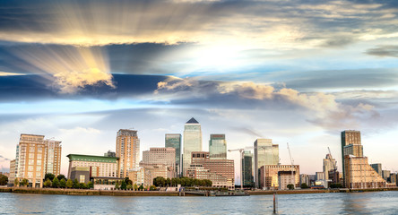 Sunset panoramic view of Canary Wharf buildings - London, UK