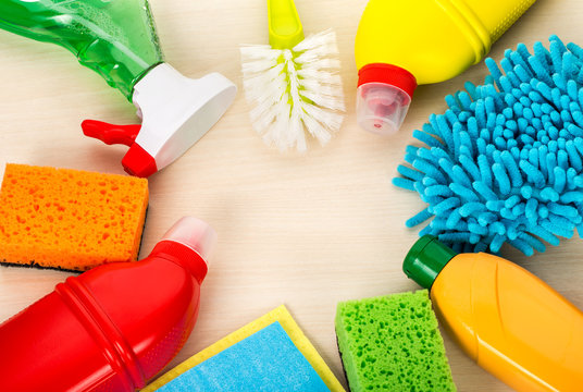 cleaning supplies on wooden background