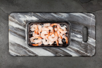 Shrimps slate background