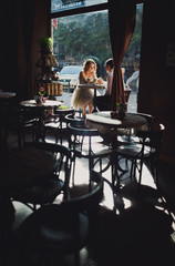 The lovely couple in love holds hands in restaurant