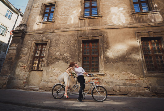 The couple in love rides by bicycle