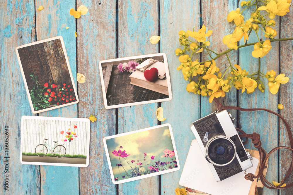 Wall mural retro camera and instant paper photo album of valentine day on wood table - photo of remembrance and