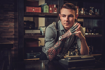 Professional hairstylist in barbershop interior