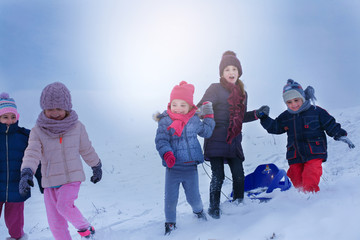 Group of children in the snow.