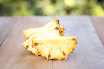 Pineapple slices on wood table