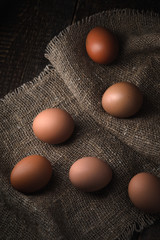 Chicken eggs on the canvas vertical