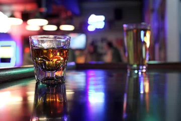 Fotobehang Alcohol Shot of whiskey and a beer at a dive bar.