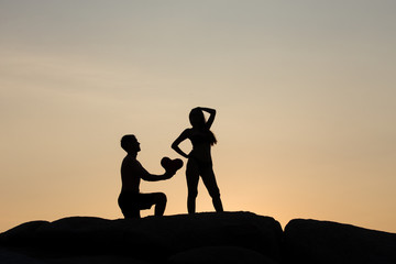 Fototapeta na wymiar silhouette of couple at sunset summer, healthy concept.