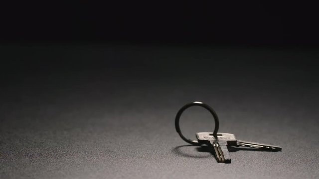 SLOW MOTION: Keys fall on a floor