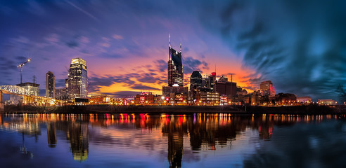 Fototapeta na wymiar Nashville skyline with blue clouds and orange background