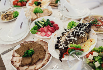 The dishes on the wedding table in restaurant
