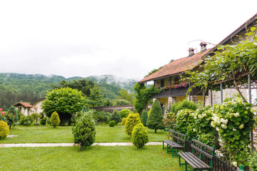 Fototapeta na wymiar View of moraca monastery and green garden near Budva old city, Montenegro