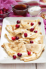 Russian pancake blini on white wooden background