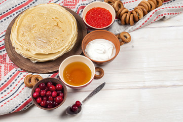 Russian pancake blini on white wooden background