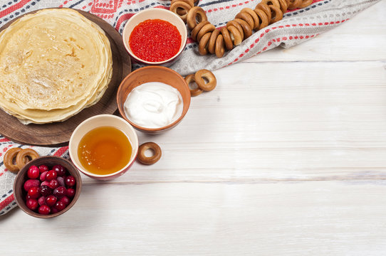 Russian pancake blini on white wooden background