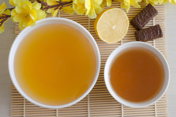 Dessert - honey and green tea. Artificial yellow flowers