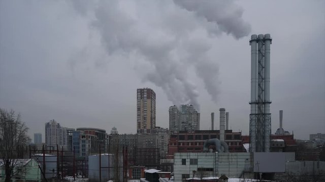 Thermal power plant . Industrial smoke from the pipes. Timelapse.