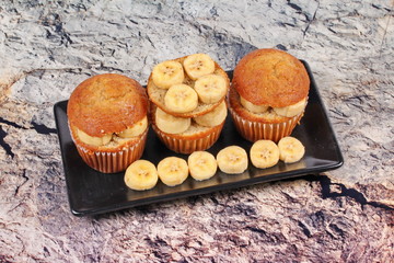 Homemade banana cakes topped sliced banana.