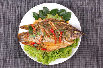 Curry-fried Tilapia fish with spicy topping.