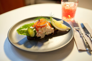 close up of toast skagen with caviar and bread