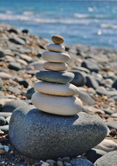 Fototapeta na wymiar Rocks, pebbles or stones stacked in a feng shui manner
