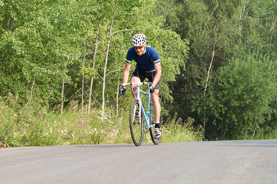 cyclist trains,  young man in a sports bike.
