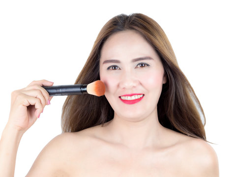 asian beautiful woman applying cosmetic powder brush on smooth face isolated on white background. skincare, cosmetology concept.