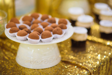 golden candy bar with truffle candies