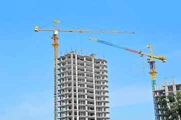 Crane and highrise construction site