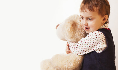 Beautiful baby girl playing with a teddy bear (Childhood, joy, s