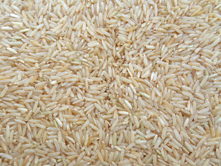 Uncooked Brown Jasmine Rice Close-up for Background, Texture 
