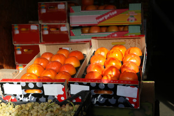 Fresh fruits in boxes on market