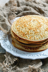 Delicious pancakes on a white plate.