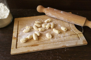 Fototapeta na wymiar Homemade gnocchi on a wooden board