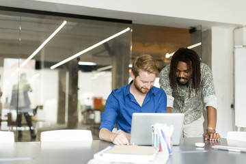 Multiracial male team in office