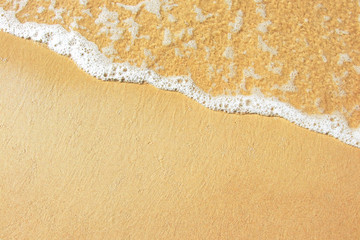 Tide. Wave on sand