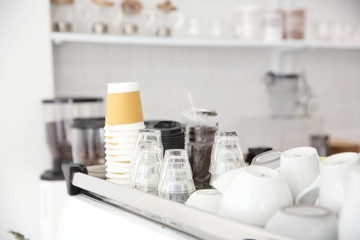 Coffee cups on Coffee machine in white coffeeshop