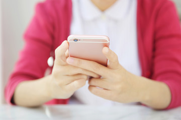 one asian woman with smart phone