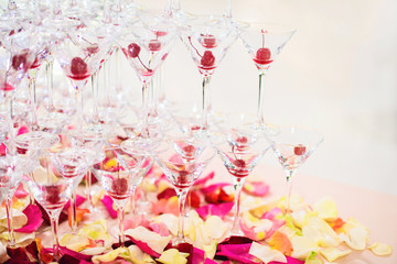 a pyramid of glasses with champagne