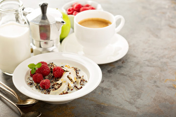 Quinoa porridge with raspberry and coconut flakes