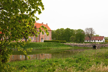 Castle with moat and an arched bridge