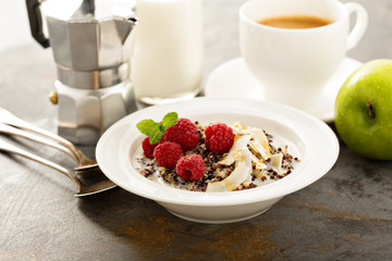 Quinoa porridge with raspberry and coconut flakes